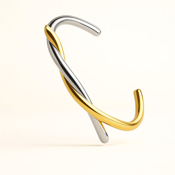 Gold and silver nose ring on a white background